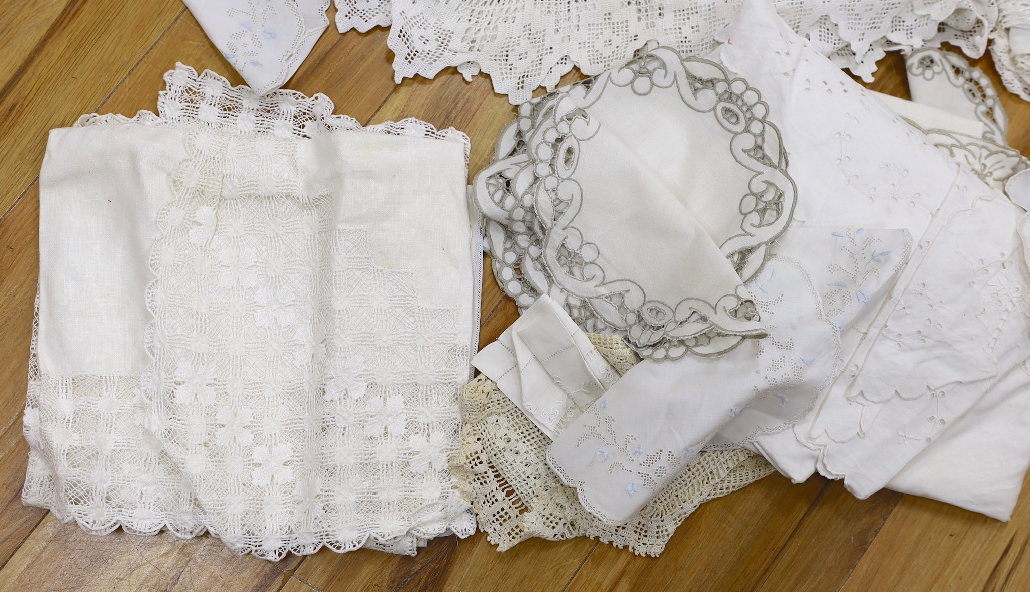 A collection of cut work and crochet edged table linens